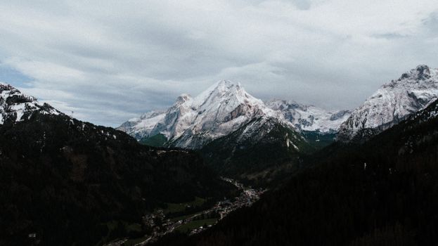 Breathtaking view of snow-capped Dolomites in Canazei, Trentino, Italy.