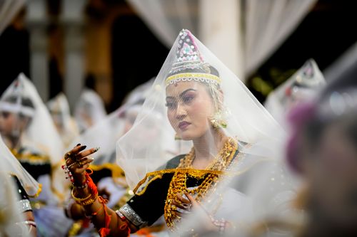 Free Indian classical dancers in traditional attire performing in Imphal, showcasing vibrant cultural heritage. Stock Photo