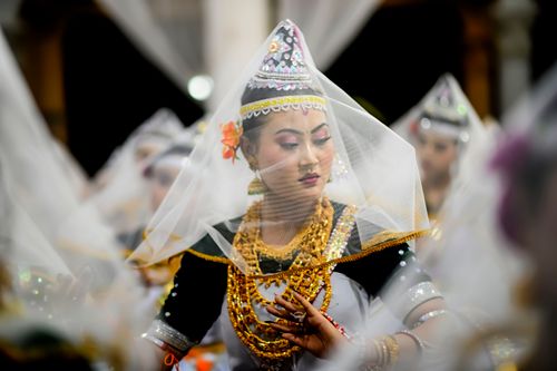 Free A captivating woman performing traditional Manipuri Raas Leela dance at a festival in Imphal, India. Stock Photo