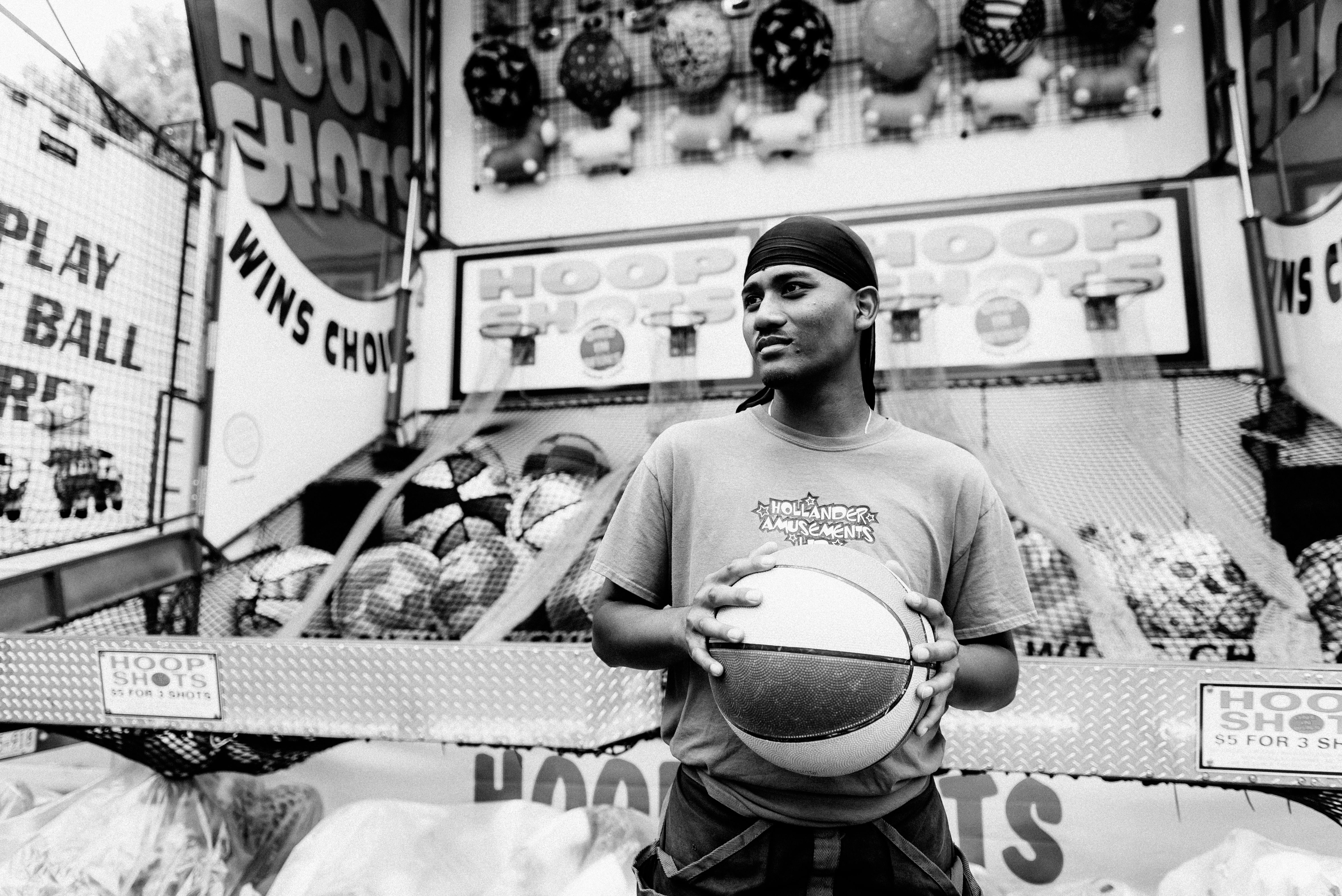Monochrome Photo Of Man Holding Basketball