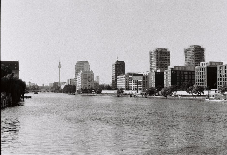 Stunning black and white view of Berlin skyline featuring the Fernsehturm and river.