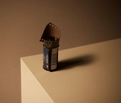 A film roll on a geometric surface, capturing the essence of analog photography.