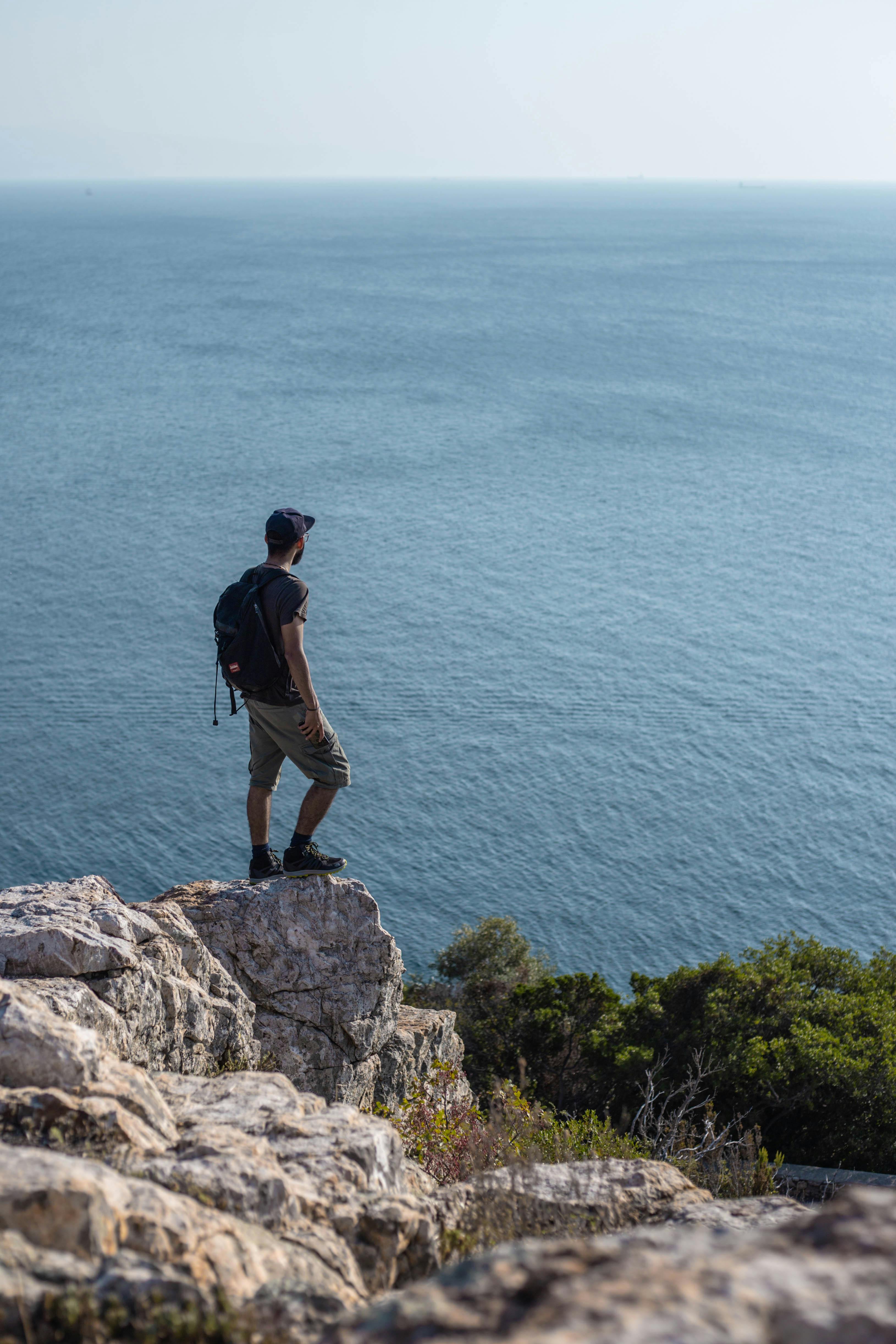 Man Standing On Cliff 
