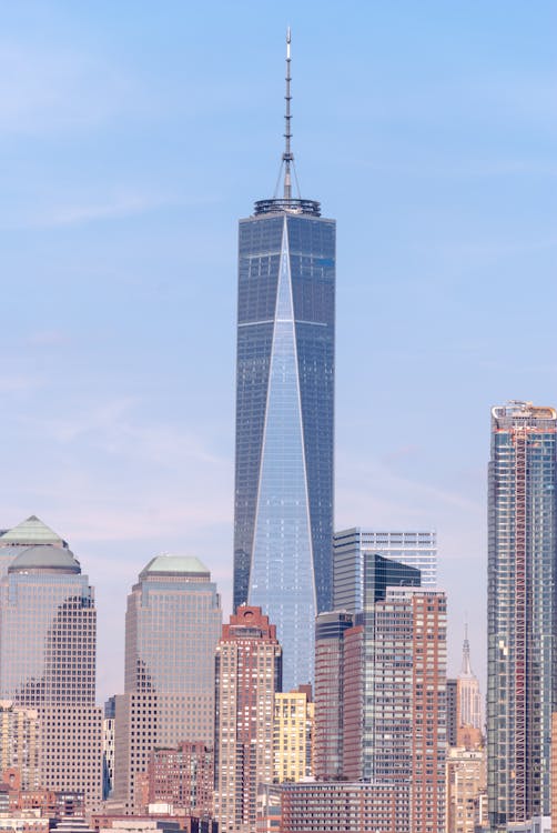 Blue High-Rise Building Towering Over The Cityscape