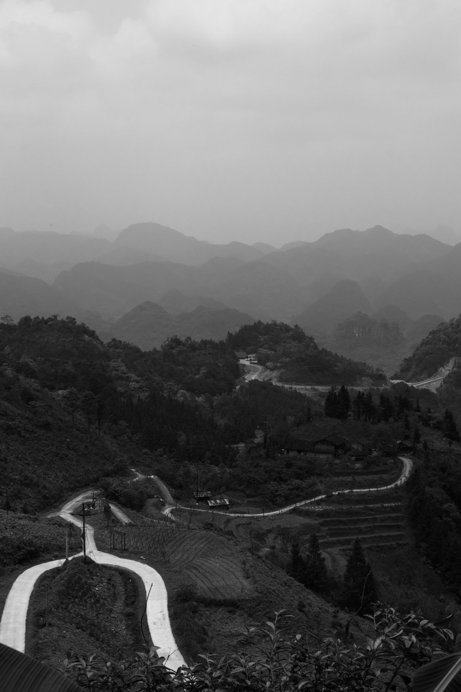 Foggy winding mountain road in Ha Giang showing why safe Easy Rider driving matters