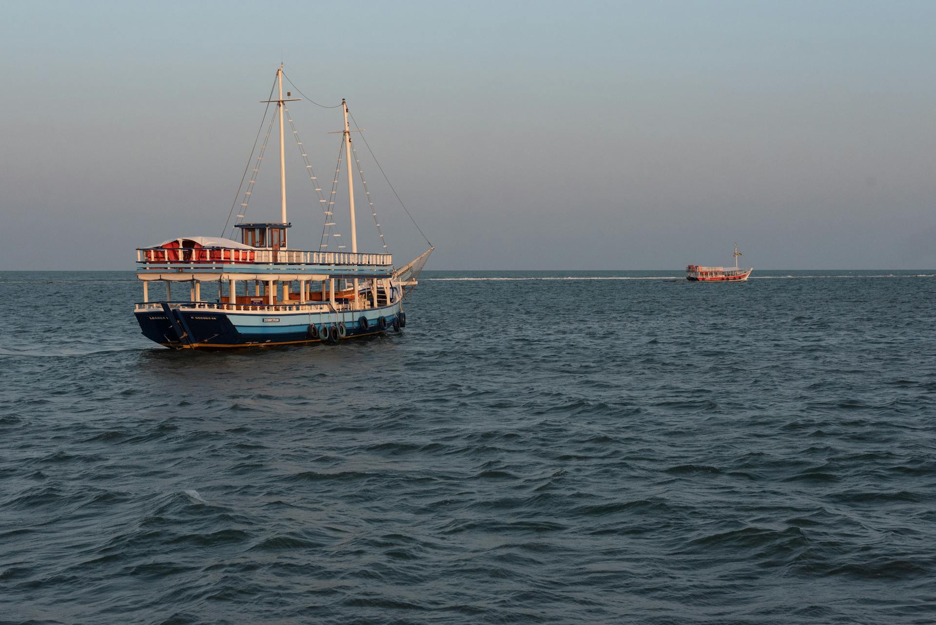 A scenic view of a traditional Brazilian boat on the Atlantic Ocean near Porto Seguro, Brazil.