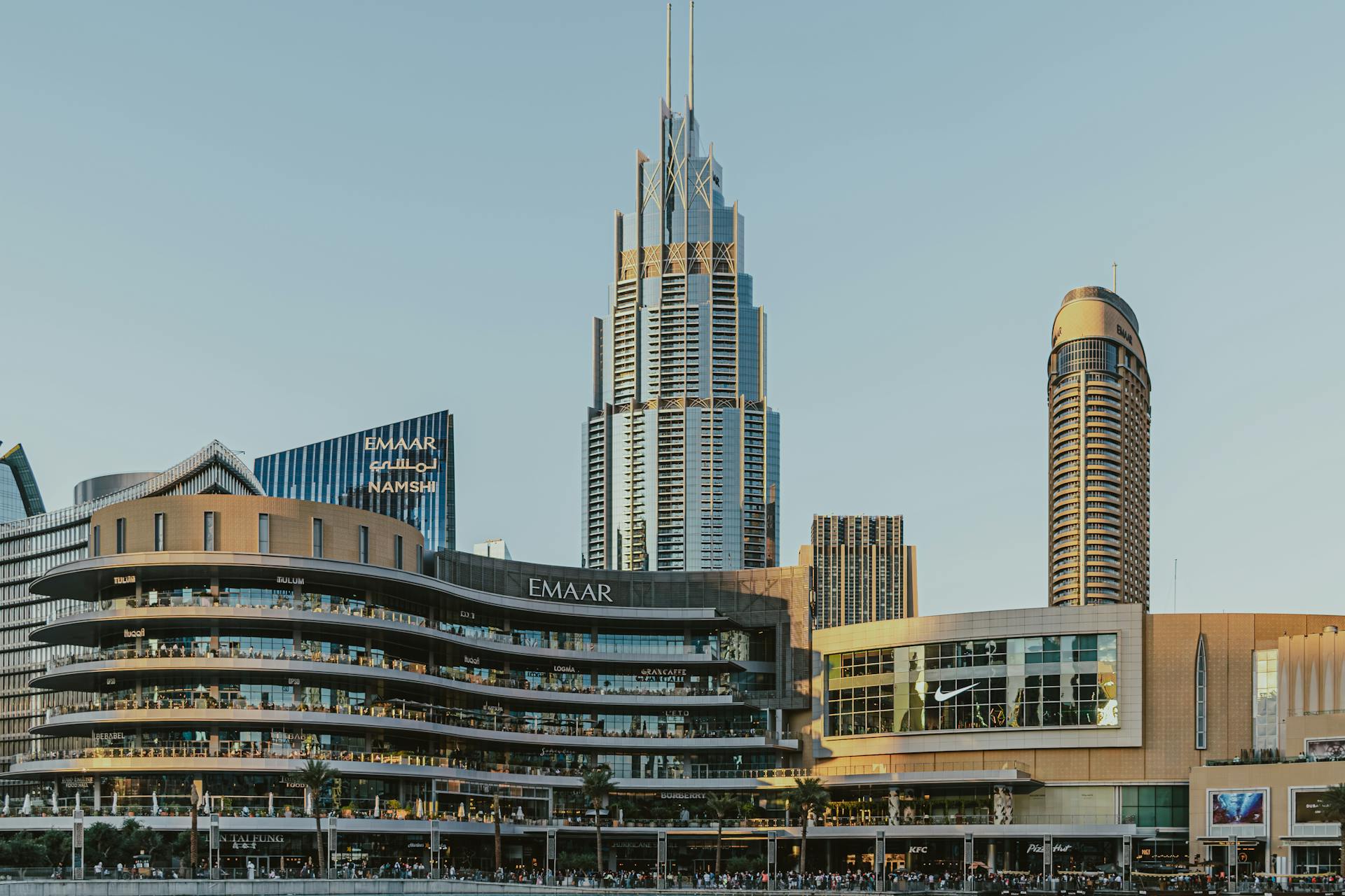 View of modern architecture with skyscrapers and shopping centers in downtown Dubai.