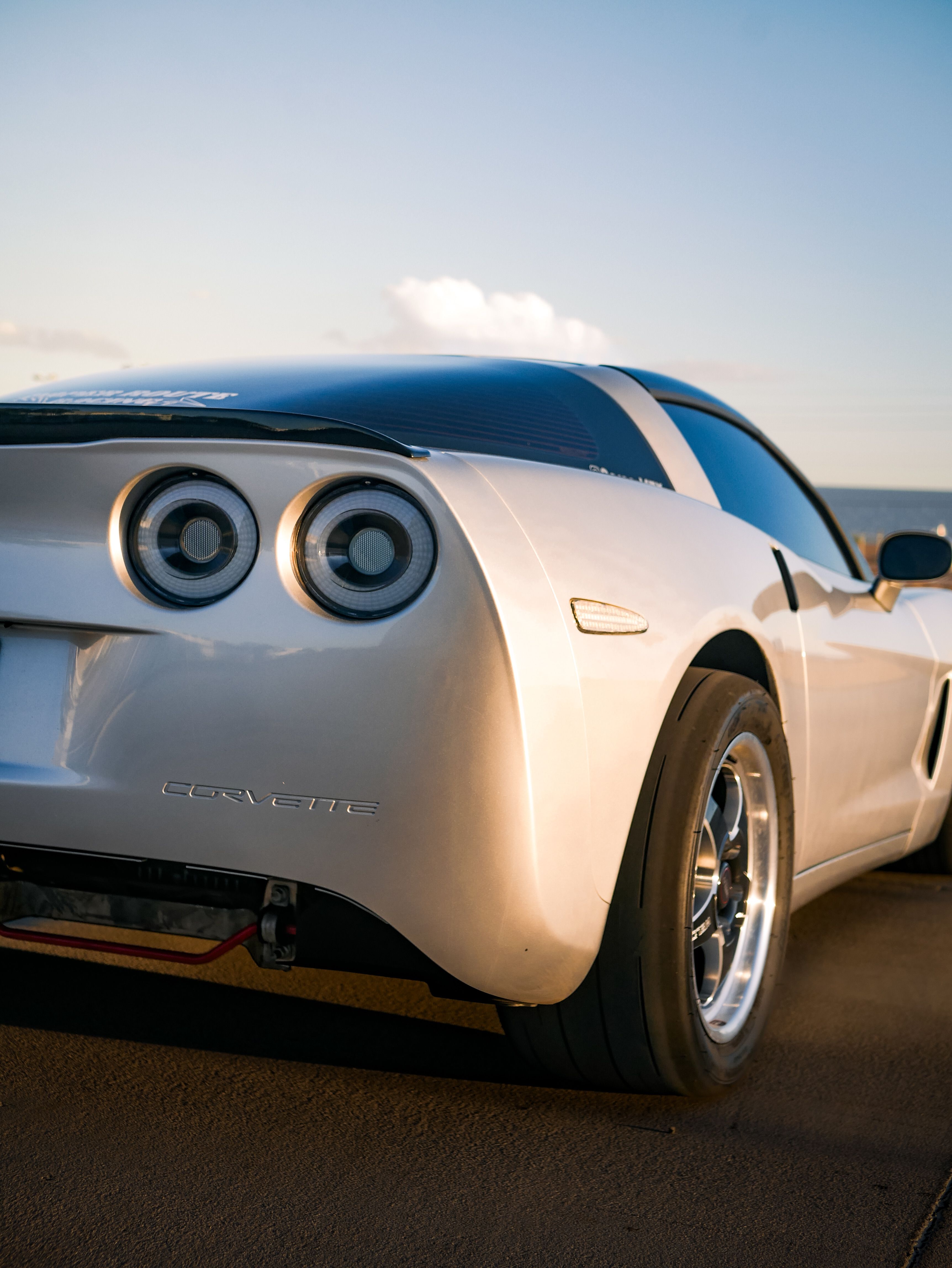 Rear View of Sports Car at Golden Hour · Free Stock Photo