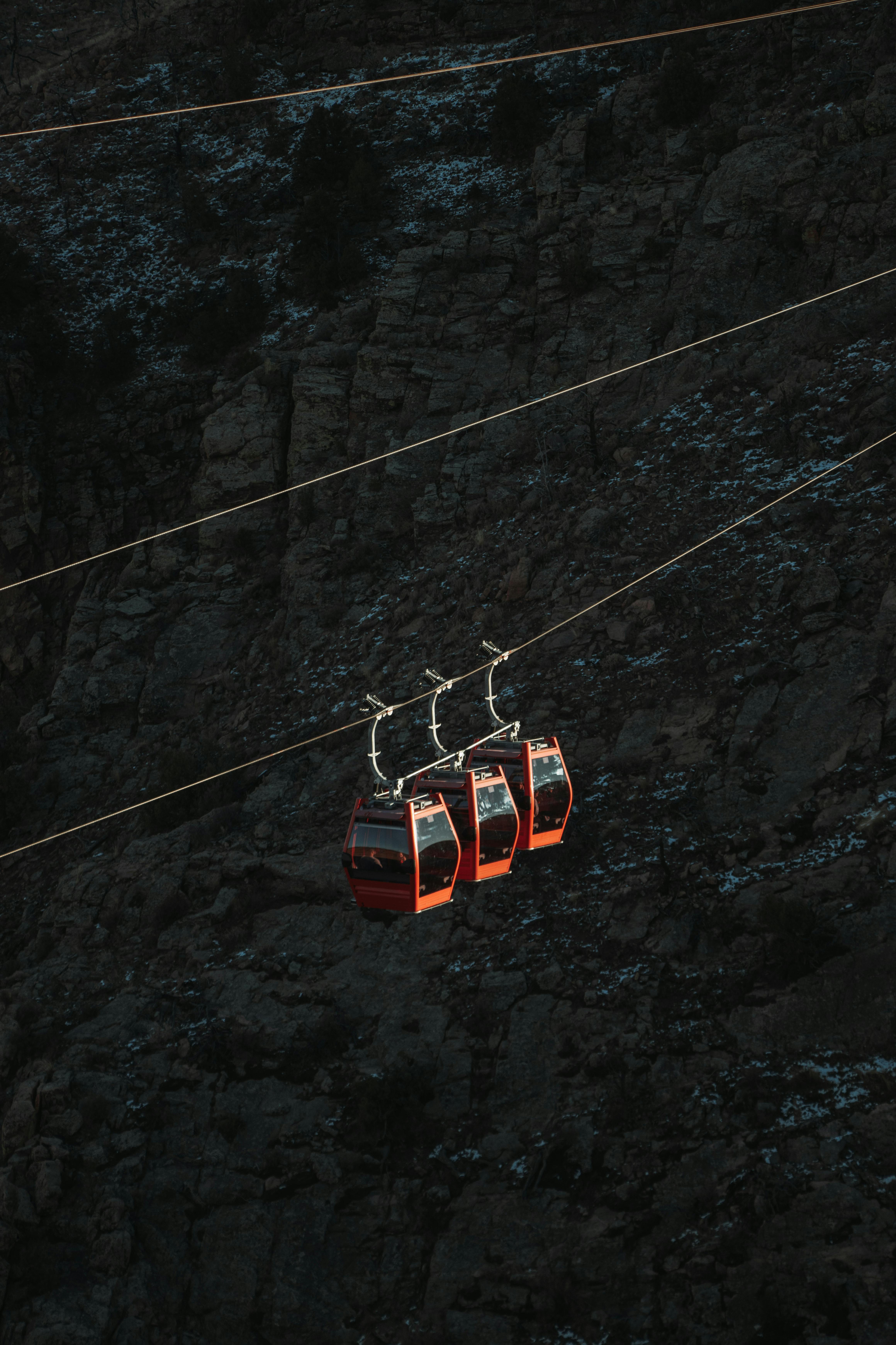 Aerial tramway cars suspended over the rocky cliffs of Royal Gorge, Cañon City, Colorado.