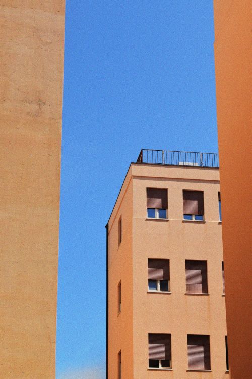 Architectural Photography of Beige Buildings · Free Stock Photo