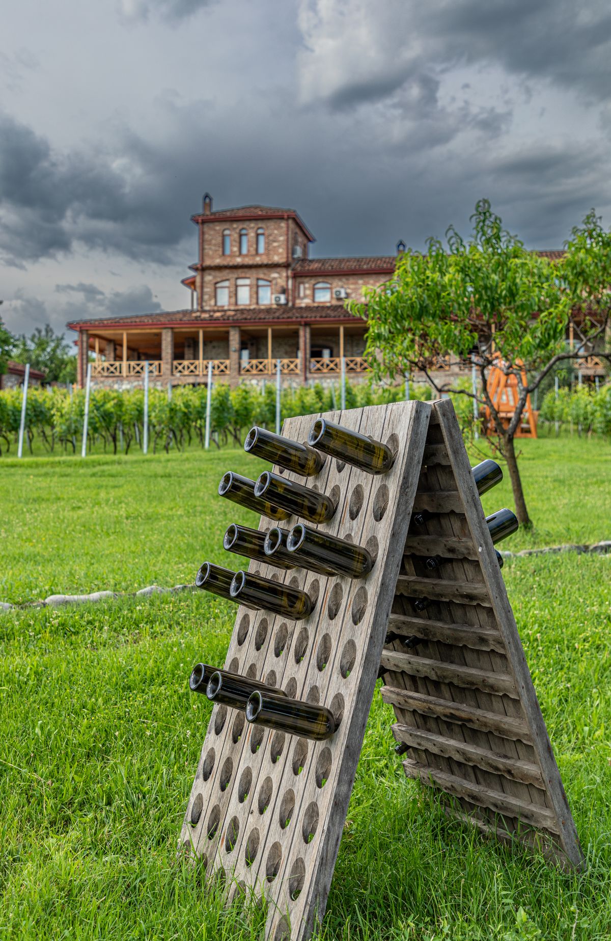 Wine bottles in a riddling rack at a historic estate in Tsinandali, Georgia