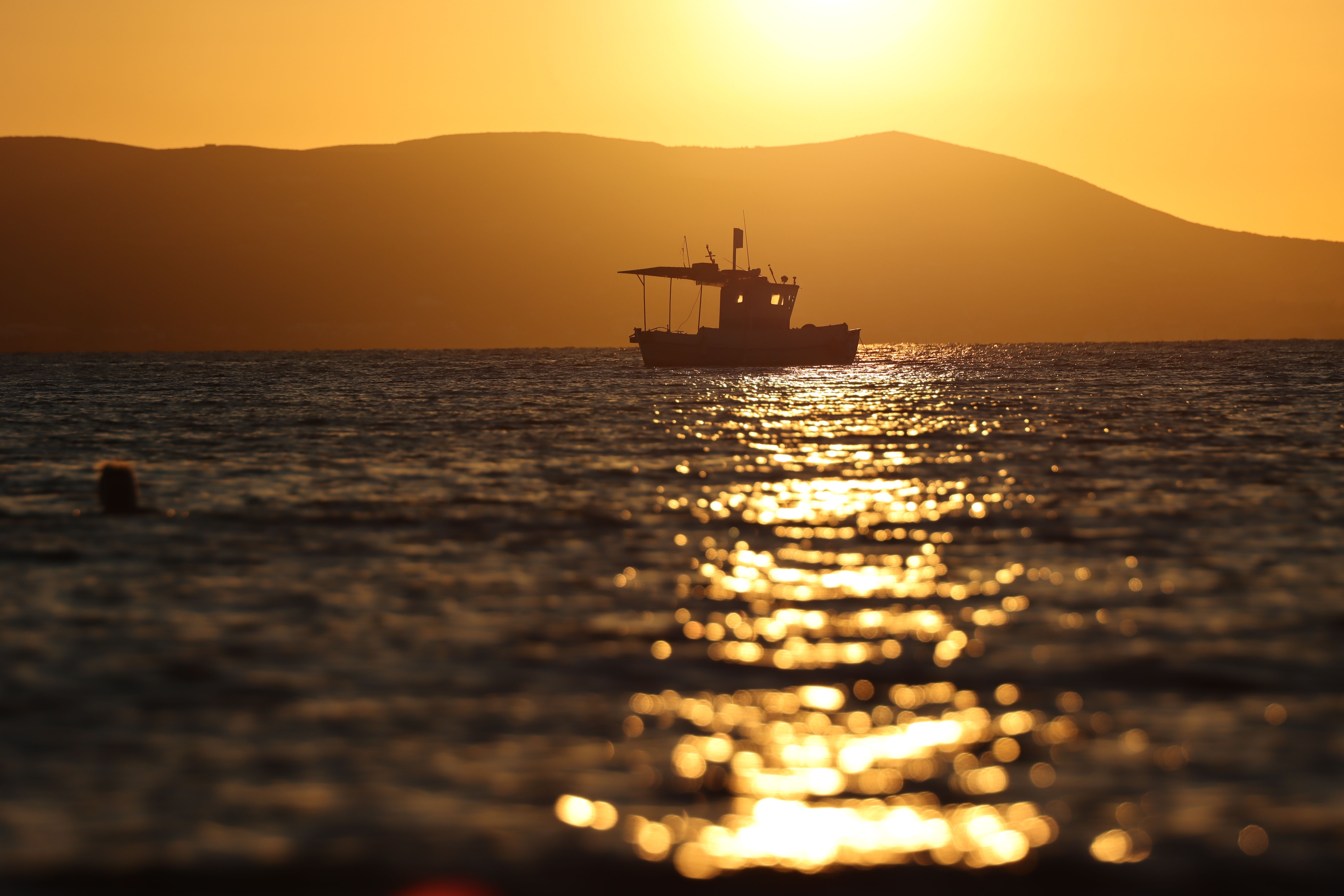 Serene Sunset on Naxos with Fishing Boat · Free Stock Photo