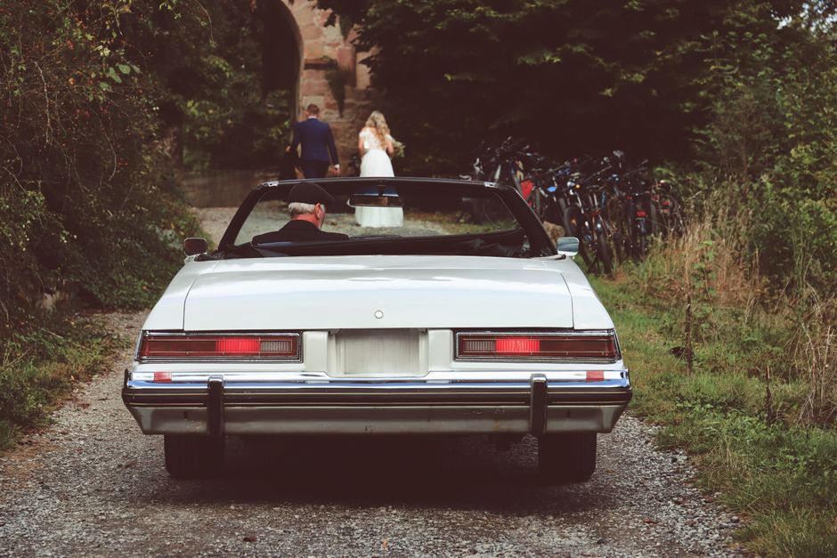 Professional services | Premier Private Rides celebrating a wedding outside their limo