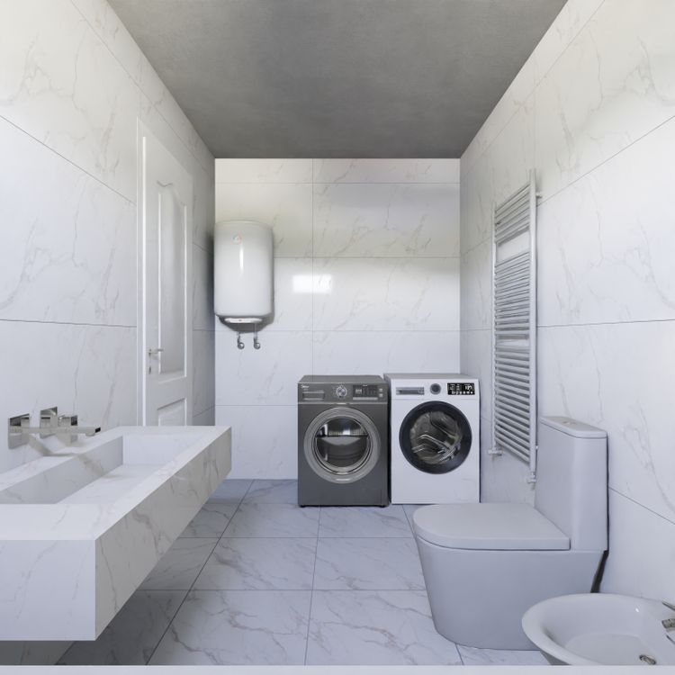 Laundry area with a washing machine and dryer beside marble-look walls