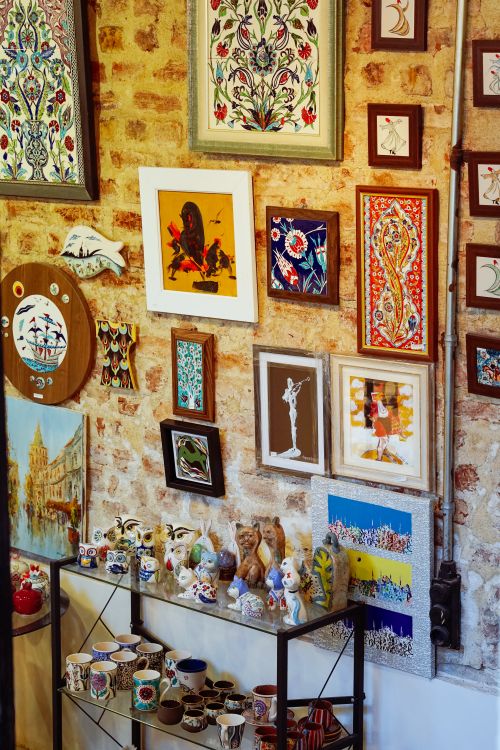 Free A vibrant array of art pieces and ceramics on a brick wall in an Istanbul gallery. Stock Photo