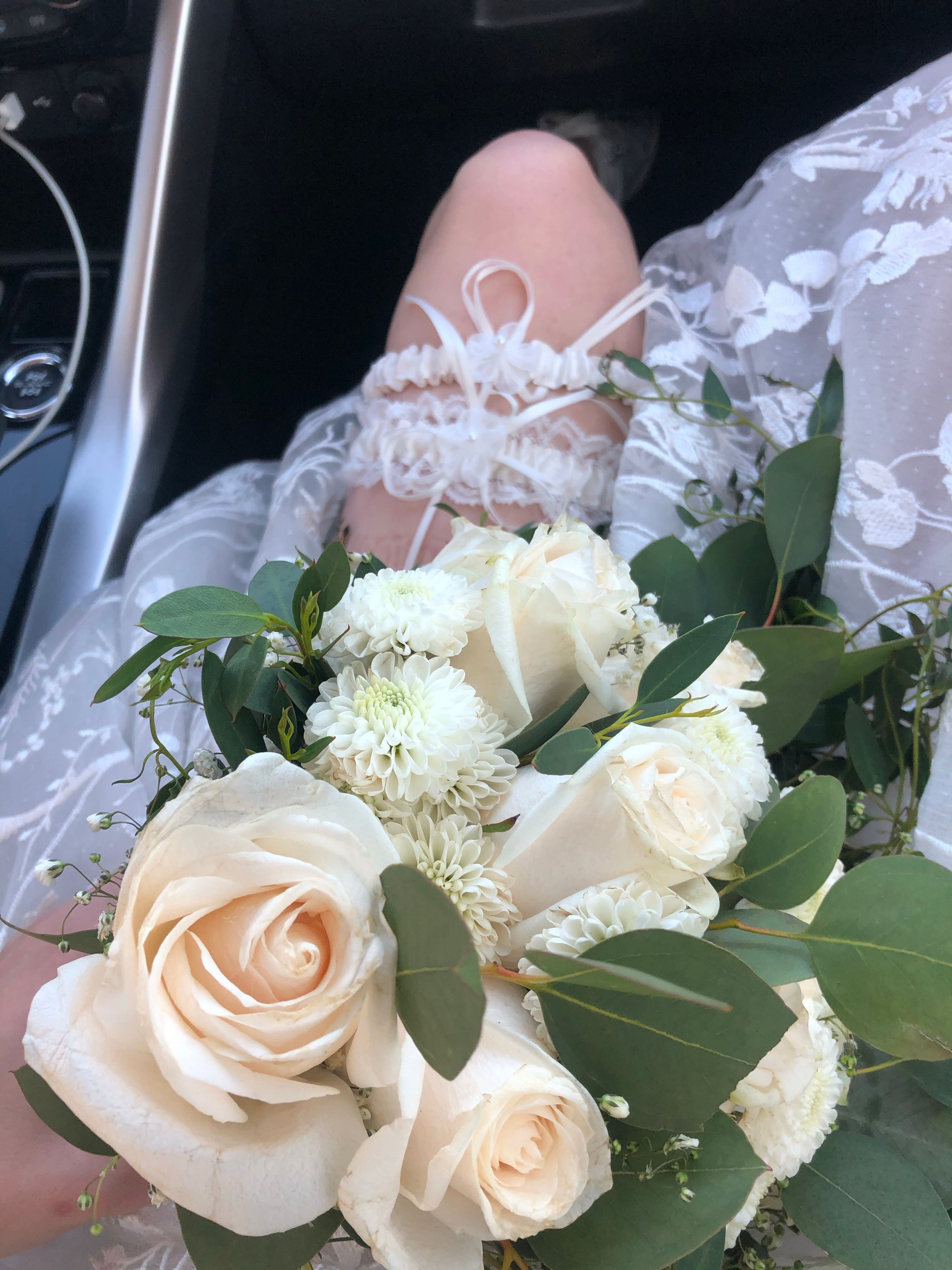 Elegant White Rose Wedding Bouquet with Garter · Free Stock Photo