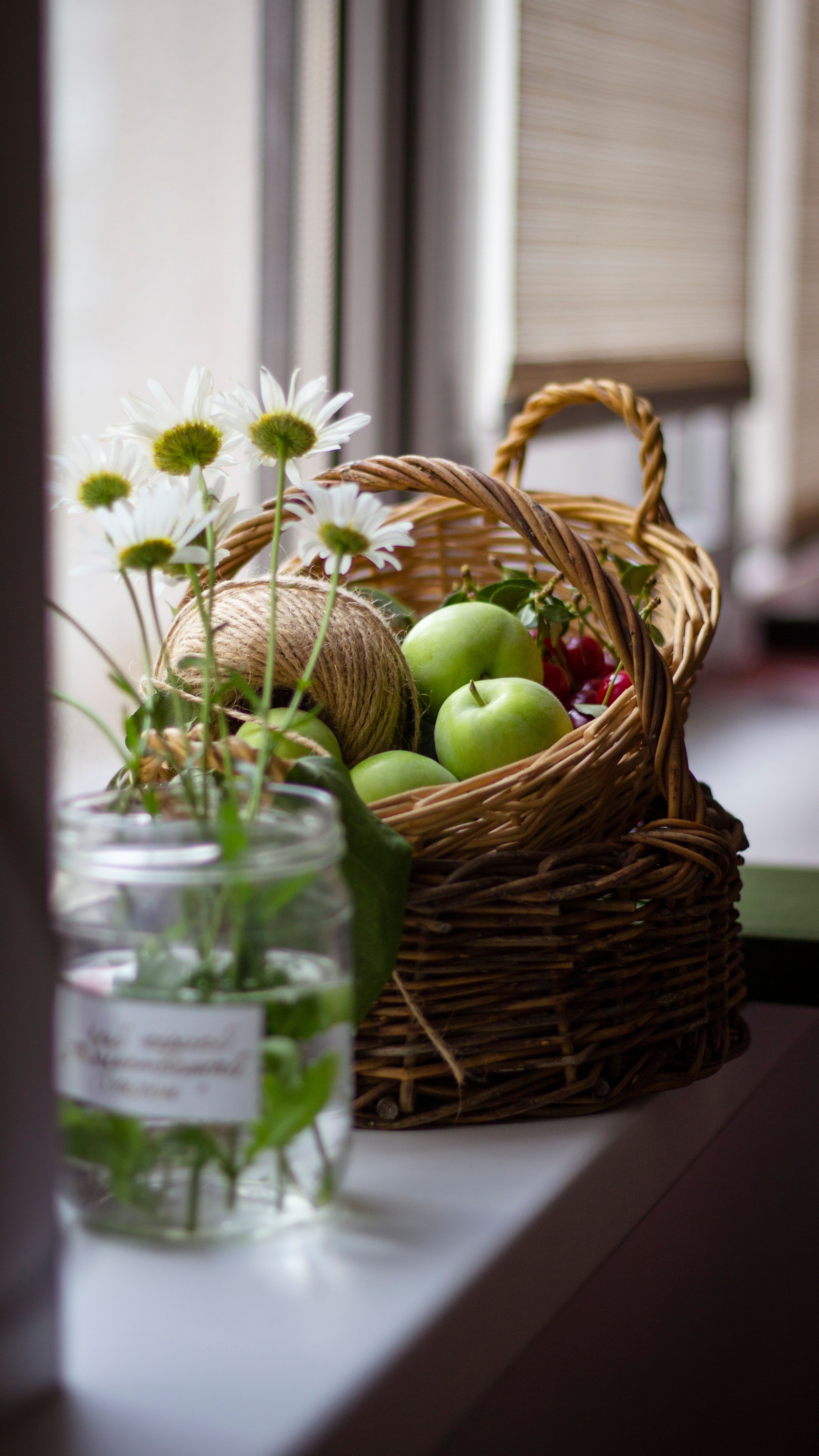 Rustic Basket with Green Apples and Flowers · Free Stock Photo