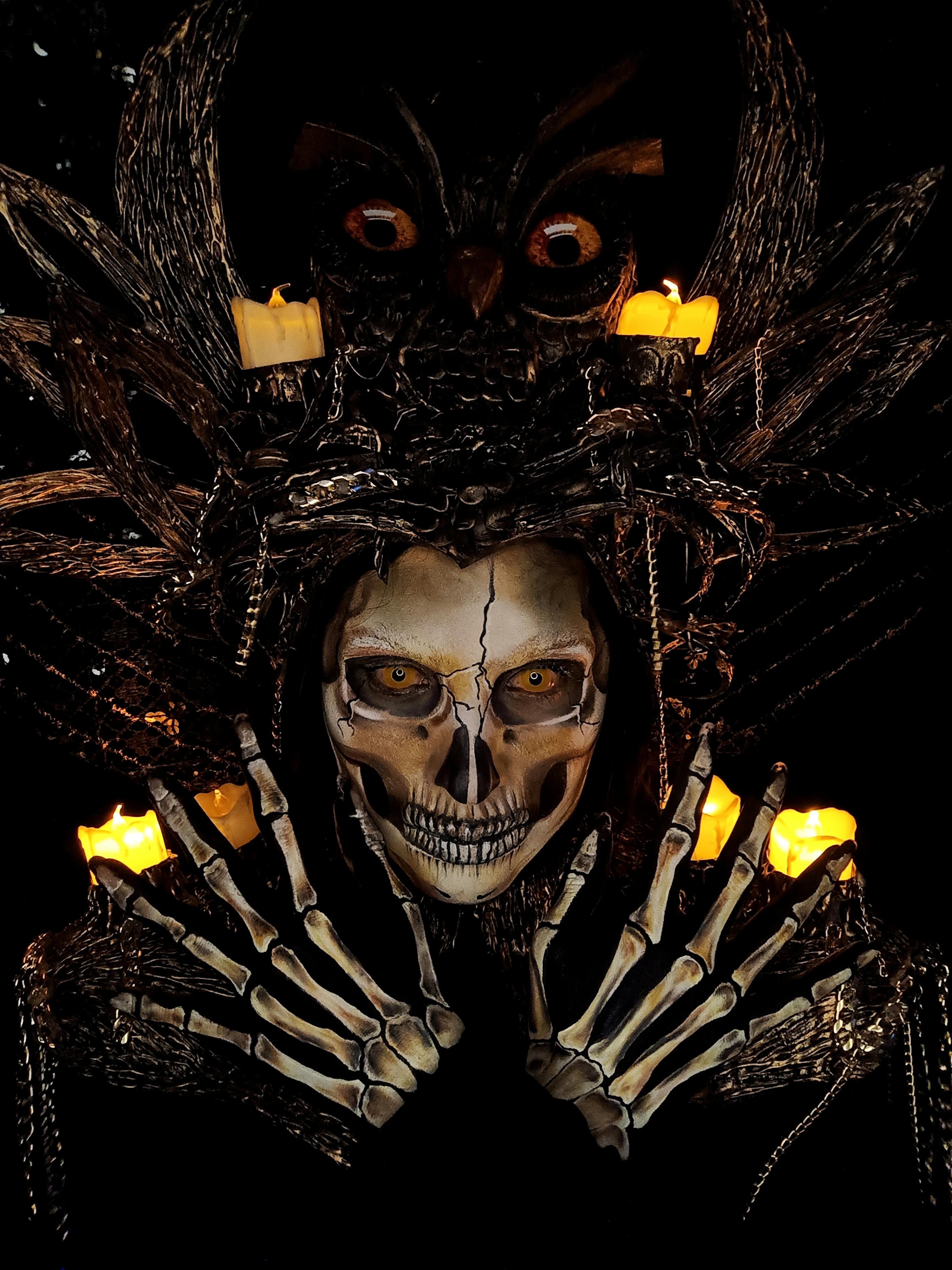 Dark artistic depiction with candles and skull · Free Stock Photo