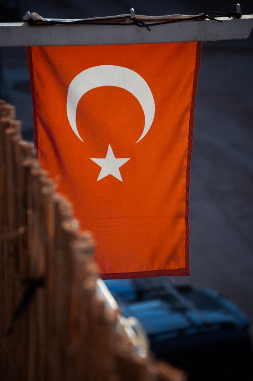 Free Turkish national flag with a crescent and star waving outdoors in a soft breeze. Stock Photo