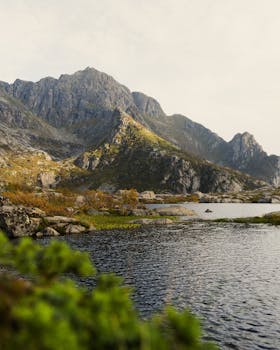 Breathtaking view of a serene mountain landscape with a tranquil lake in autumn.