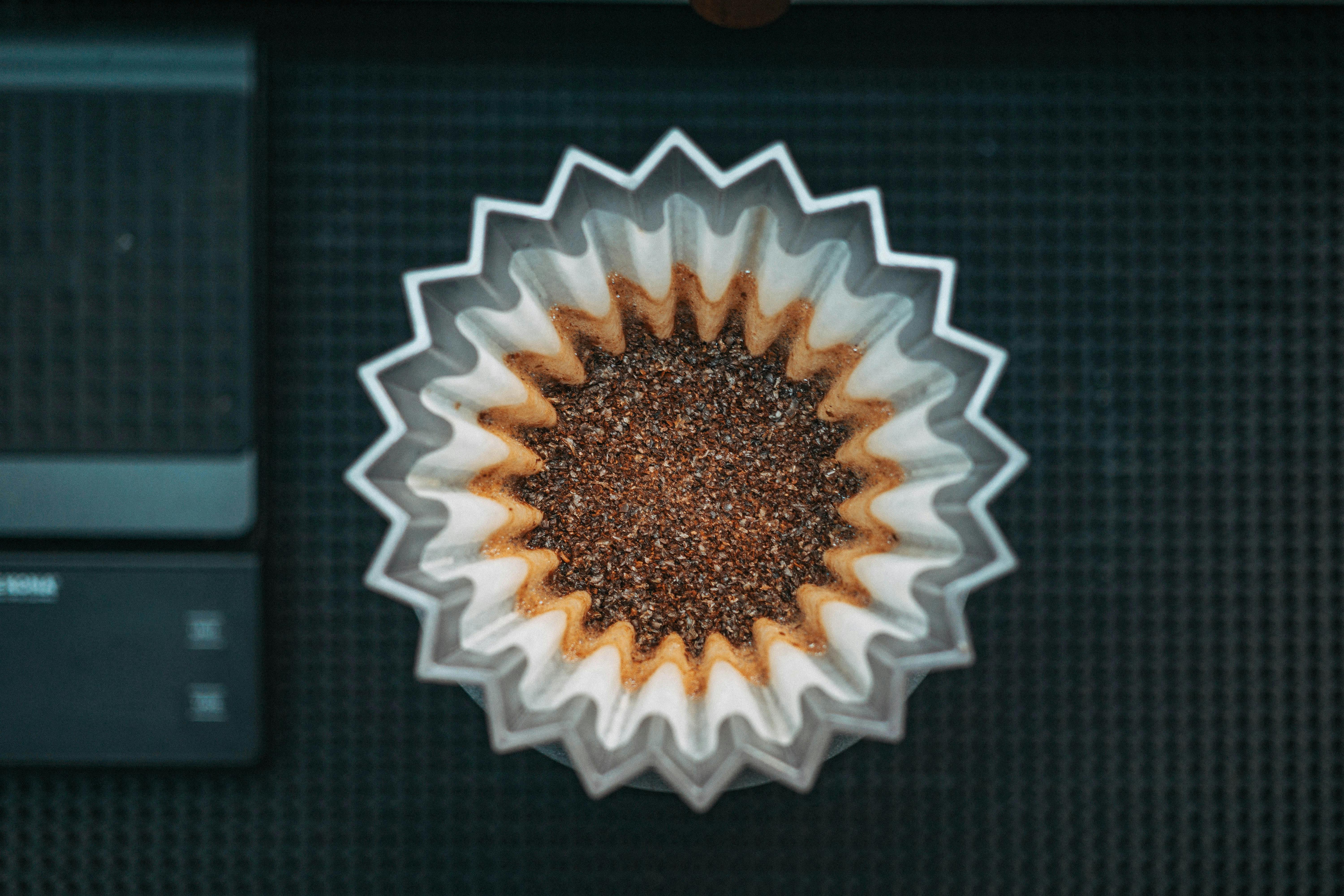 Top-down view of coffee grounds in a paper filter, offering a focused coffee brewing concept. Is Coffee Bad for You?