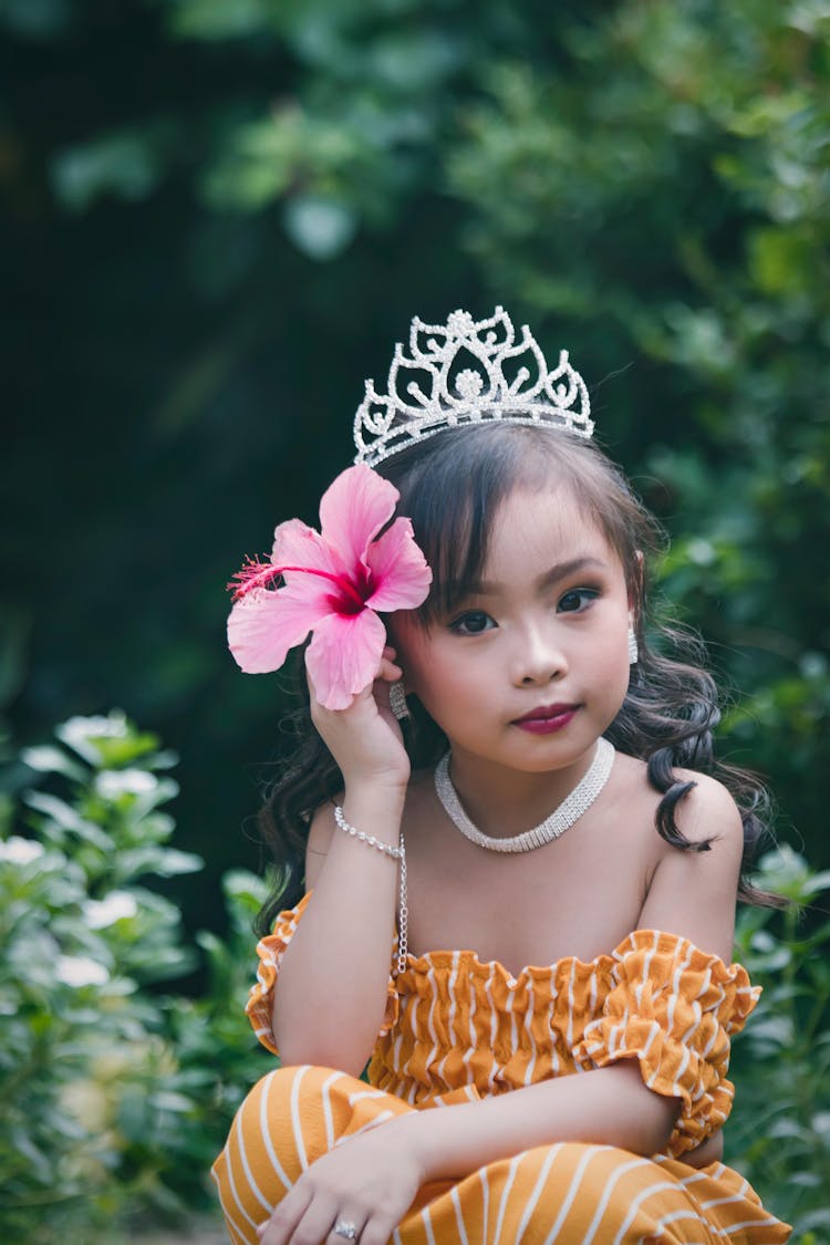 Photo Of Toddler Holding Flower