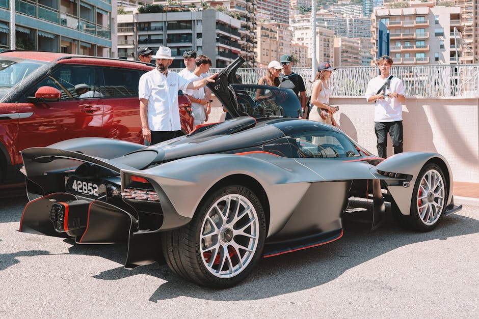 Automotive professionals at work in a sleek, modern exhibit display