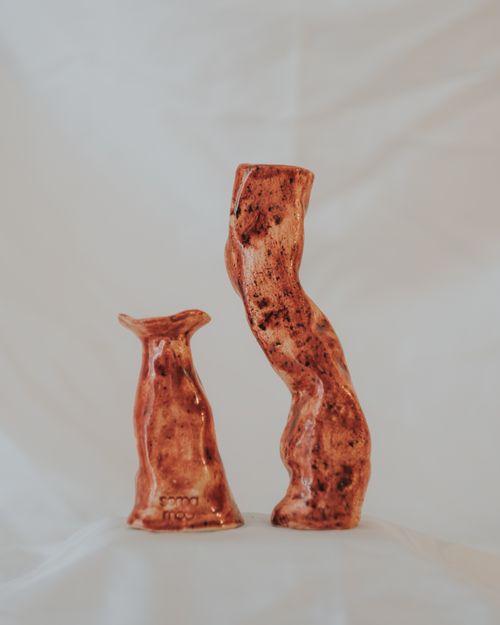 Free Unique artistic ceramic sculptures with a natural, earthy finish on display indoors. Stock Photo