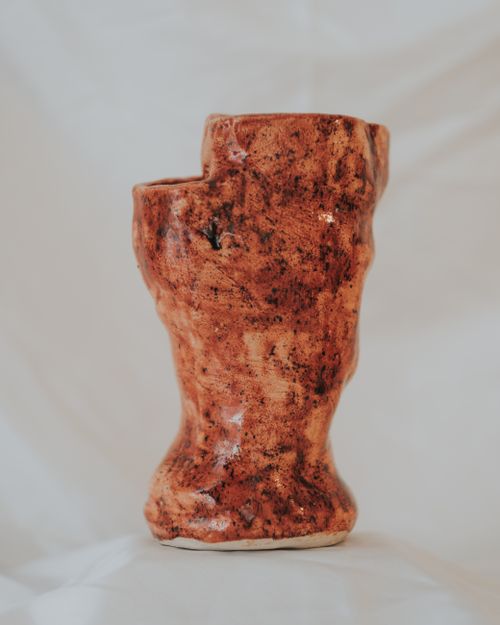 Free Unique handmade ceramic vase with rustic design, captured in a minimalist style. Stock Photo