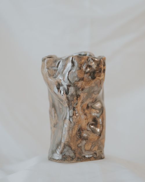 Free Unique handcrafted ceramic sculpture with an abstract textured design, ideal for decor. Stock Photo
