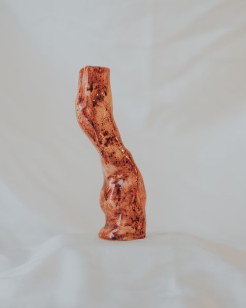 Free A distinctive ceramic sculpture with an organic design displayed indoors. Stock Photo