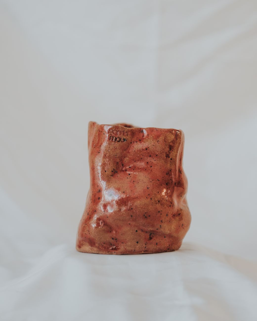 Artistic ceramic cup showcasing handcrafted details. Perfect for art lovers.