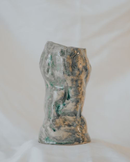 Free Artistic ceramic sculpture with earthy tones and abstract design. Stock Photo
