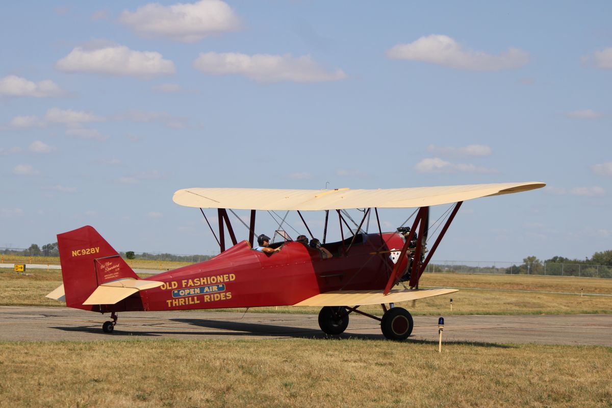 Vintage biplane at a GA airfield — representing the era of pioneering female aviators
