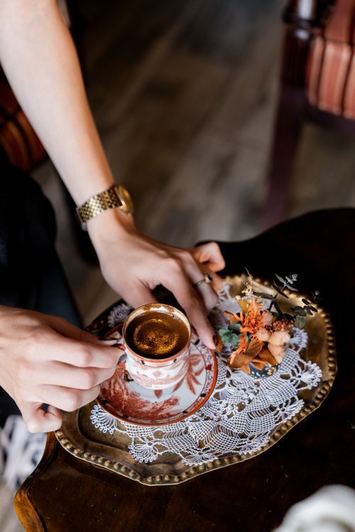 Free Elegant setting of Turkish coffee on ornate plate with lace doily in Istanbul café. Stock Photo
