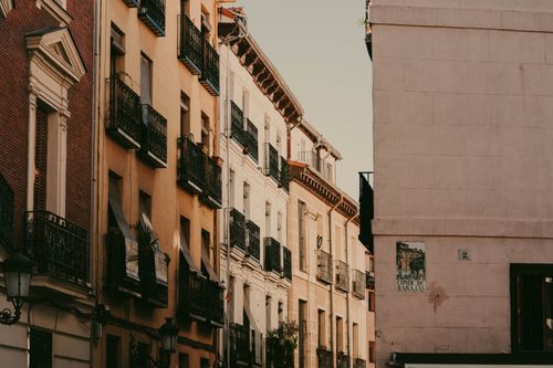 Free Charming view of historic European street with classic architecture at sunset. Stock Photo