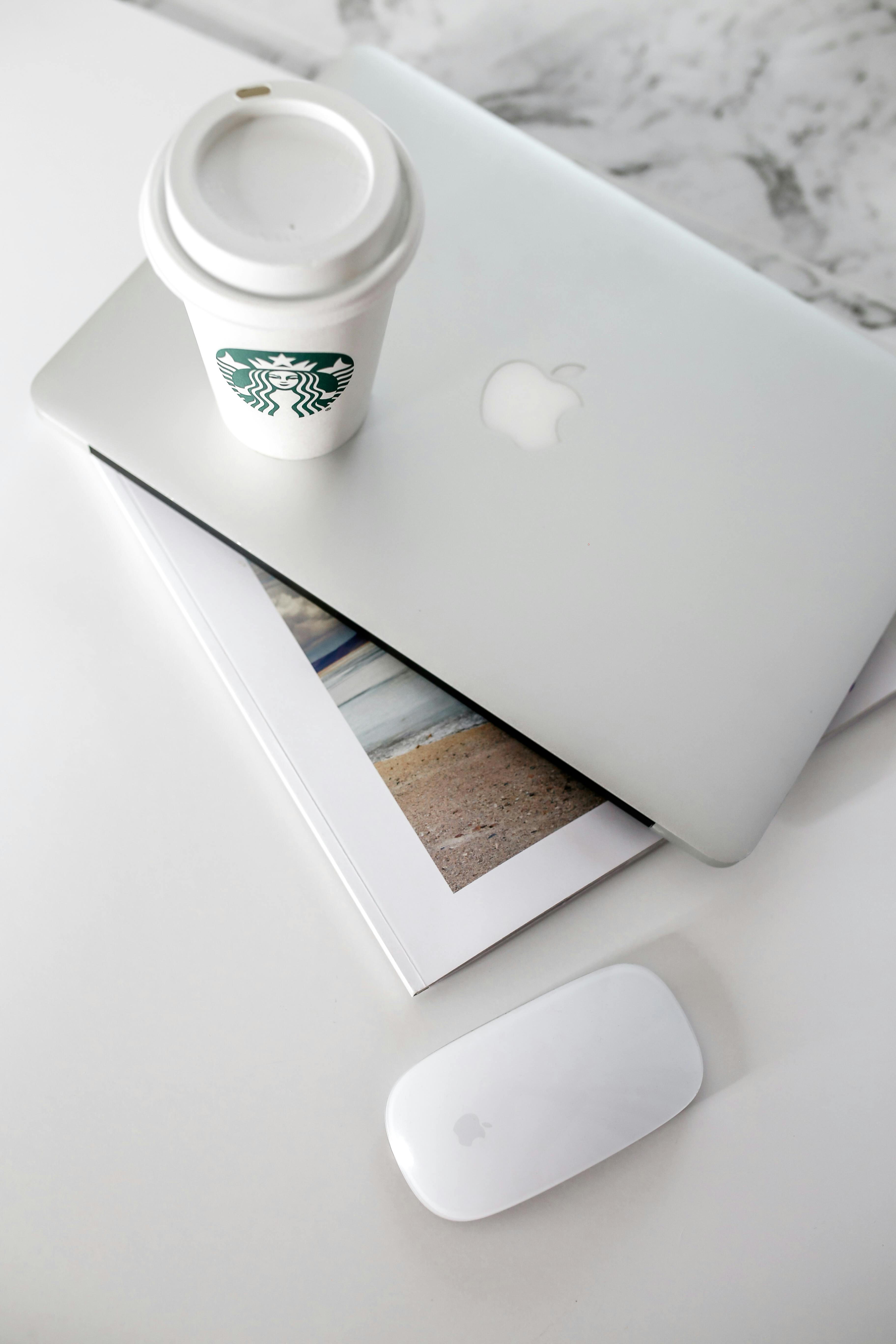 minimalist workspace with laptop and coffee cup