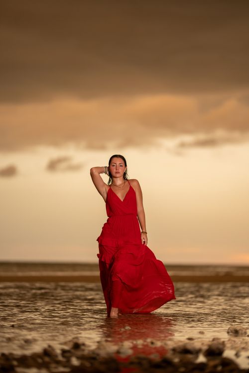Woman in Red Dress Walking on Beach at Sunset Free Stock Photo Woman in Red Dress Walking on Beach at Sunset Free Stock Photo