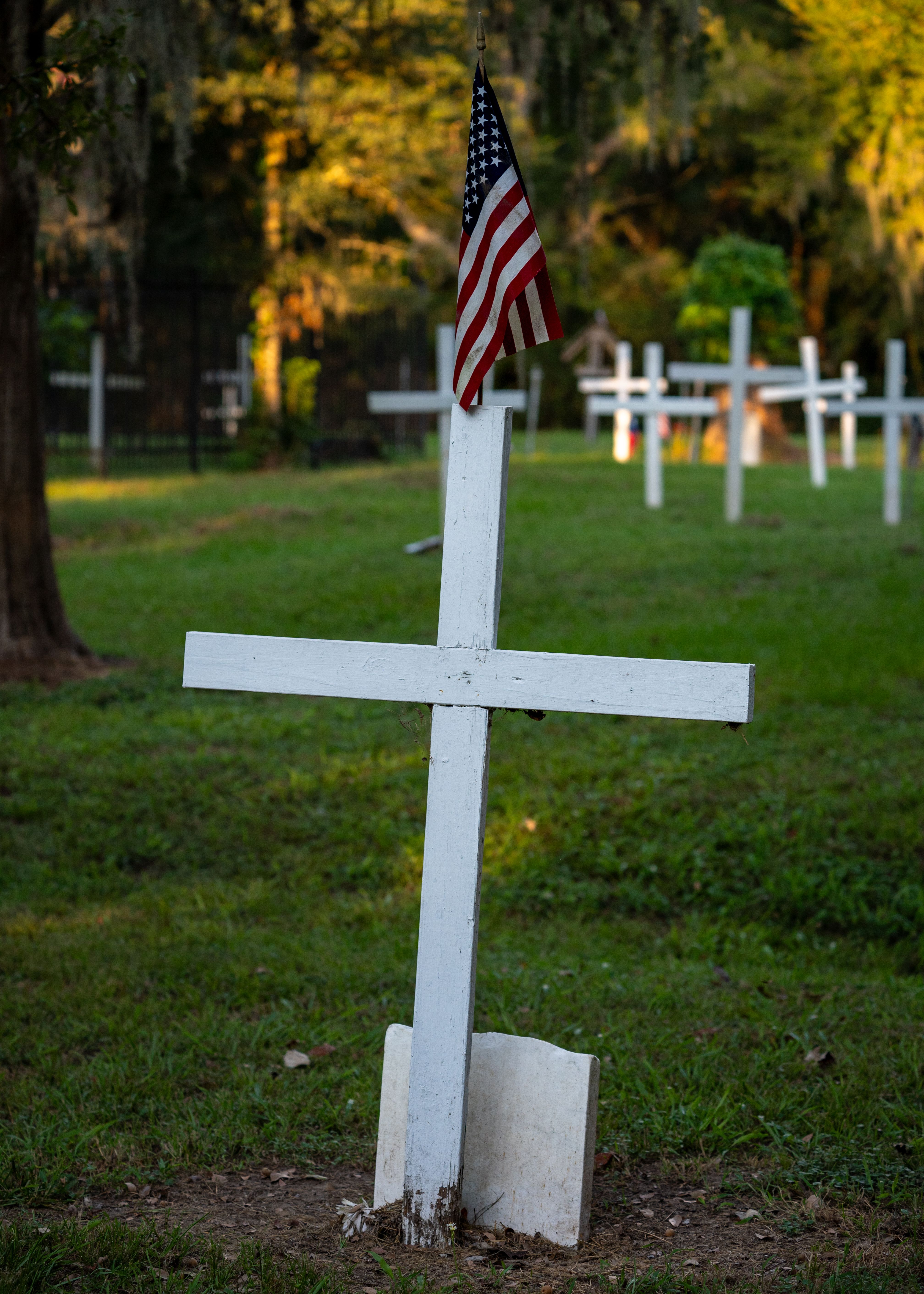 American Flag on Memorial Cross in Serenity Cemetery · Free Stock Photo
