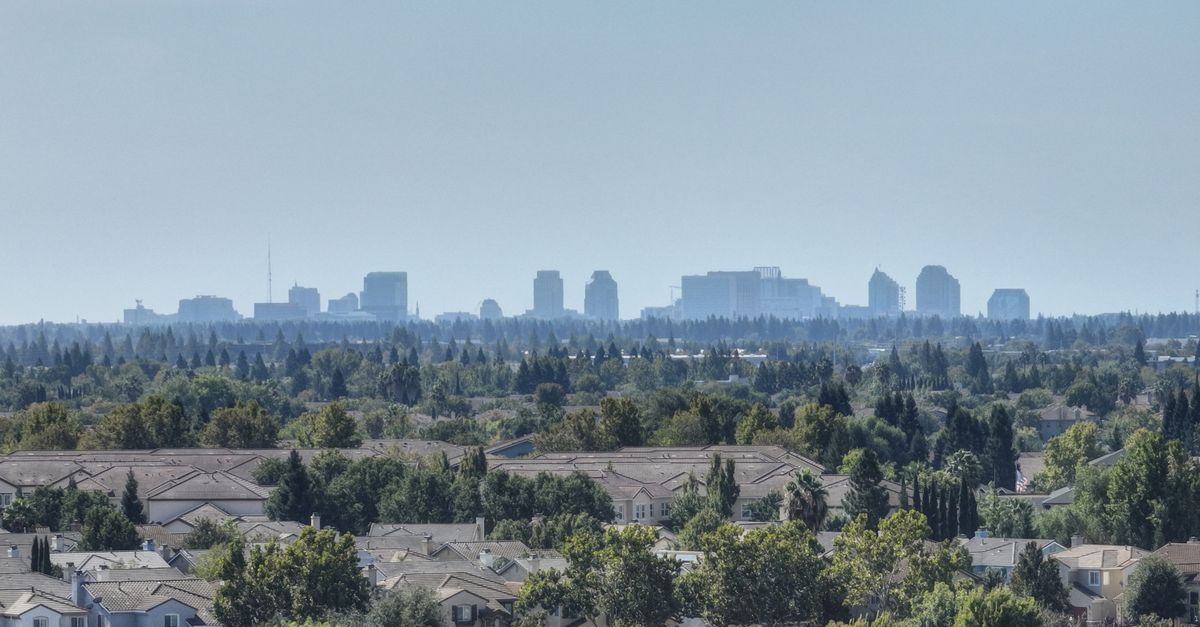 Beautiful view of Sacramento's skyline from a quiet suburban neighborhood on a bright, clear day.
