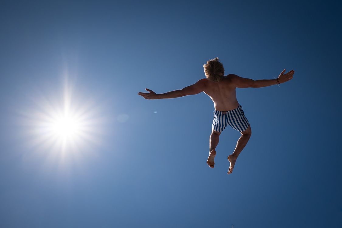Man Freefalling Under Blue Sky · Free Stock Photo