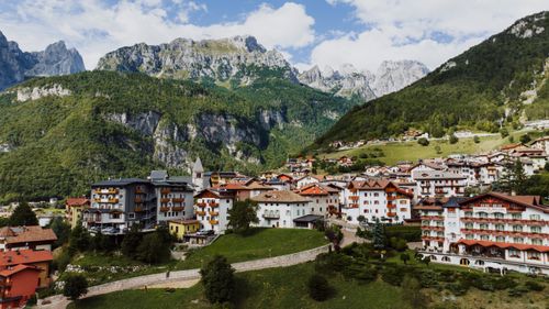 Free Picturesque Molveno village nestled in the Italian Alps with charming architecture and lush greenery. Stock Photo