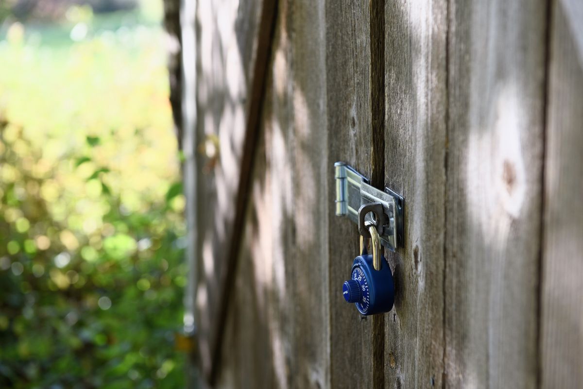 Blue combination padlock representing the privacy of irrevocable trust documents