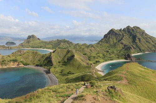 Free Scenic landscape of Padar Island in Indonesia, showcasing lush hills and turquoise waters. Stock Photo
