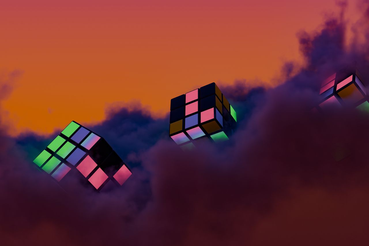 abstract 3d rendering of rubik s cubes floating in a vibrant colorful