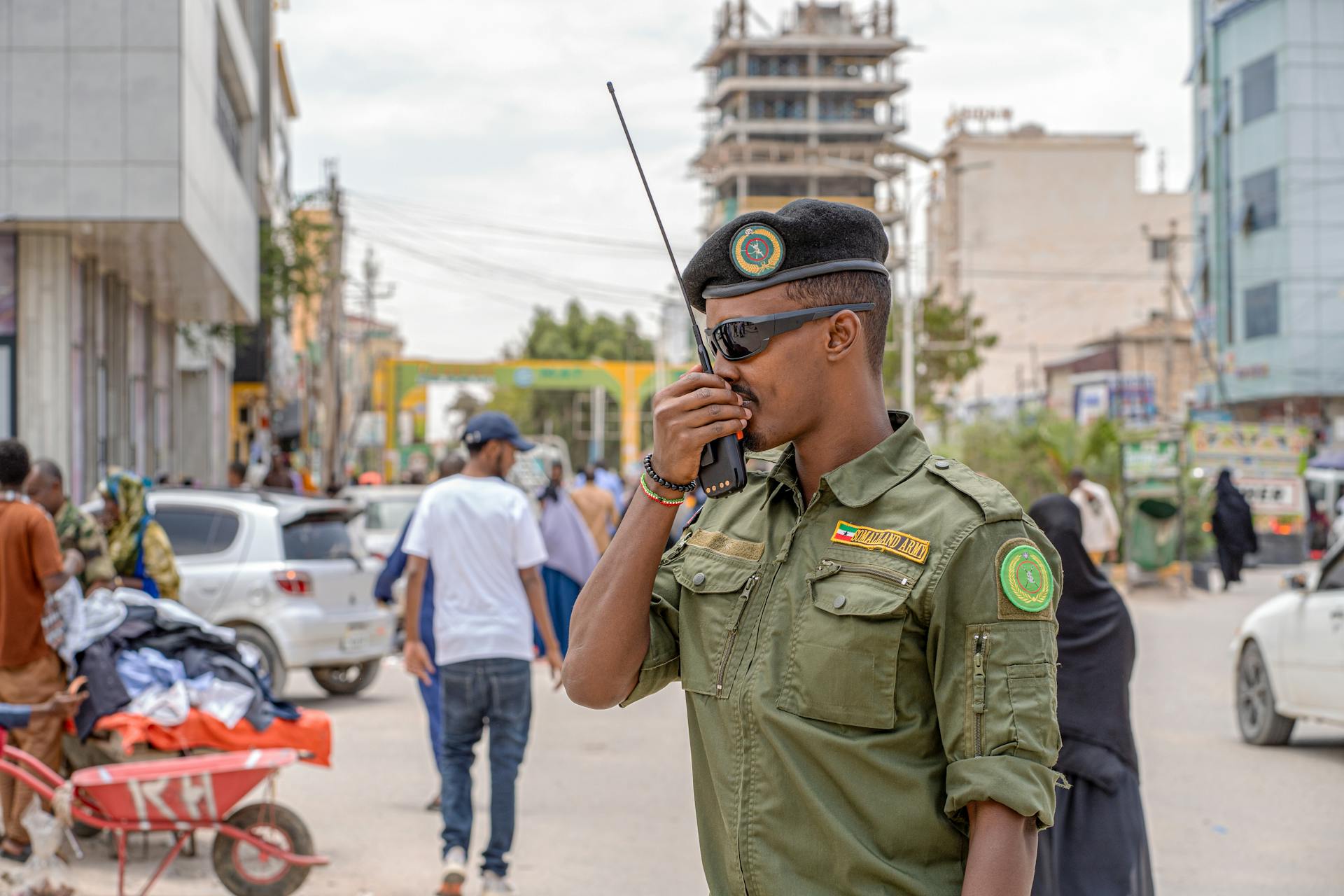 Military Officer Communicating on Street in Hargeisa