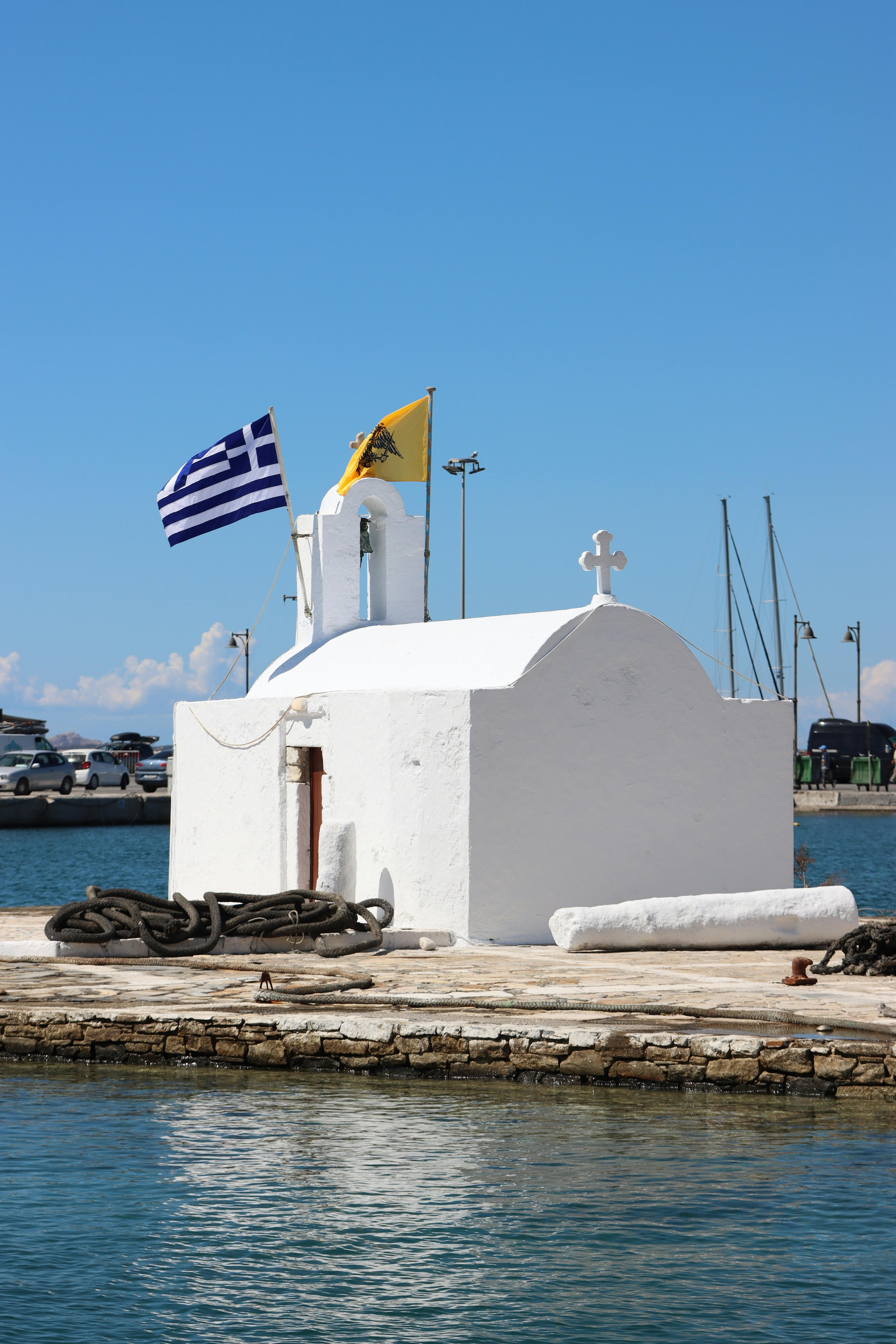 charming white church by the sea in naxos greece