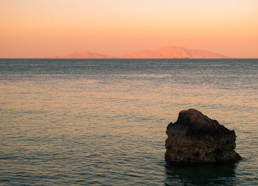 Serene beach scene at sunset in Sharm El-Sheikh, Egypt.