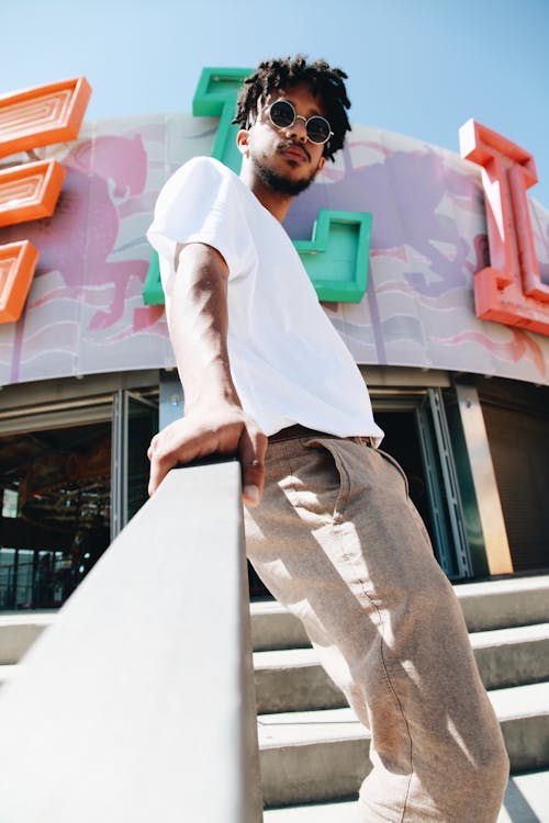 Photo Of Man Leaning On Handrail