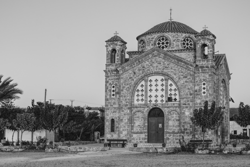 Free A vintage black and white photo of a historic Byzantine church outdoors. Stock Photo